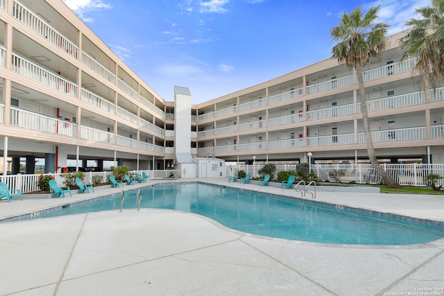 view of swimming pool featuring a patio