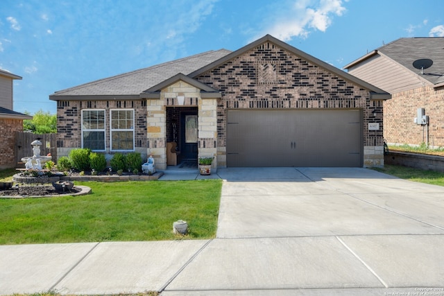 view of front of house featuring a garage and a front yard