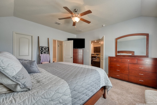 carpeted bedroom featuring vaulted ceiling and ceiling fan