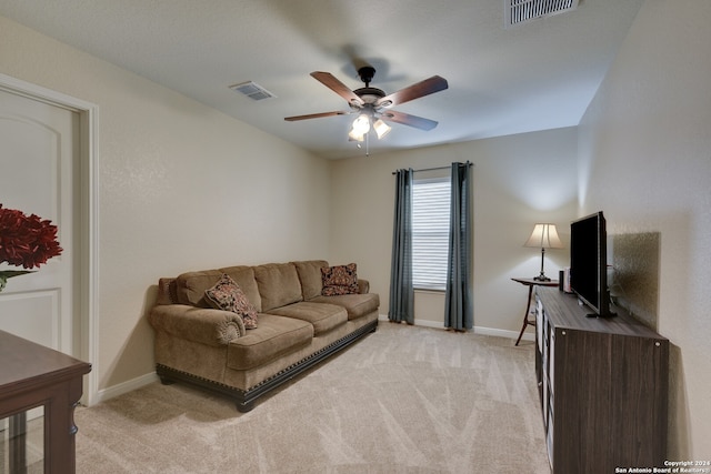 living room with light carpet and ceiling fan