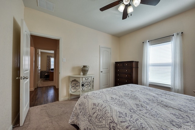 bedroom with dark carpet and ceiling fan