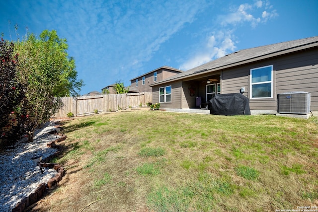 view of yard with a patio and central AC unit