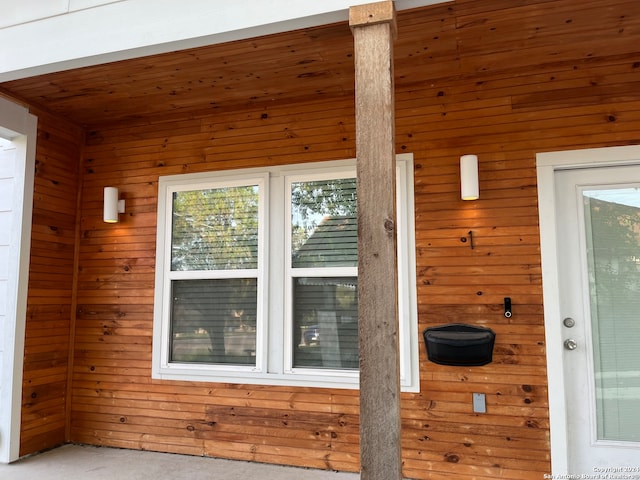 exterior details featuring wooden walls