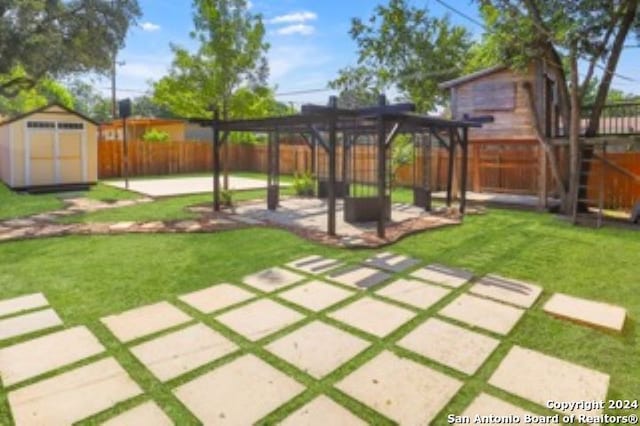 4334 Moana Dr, San Antonio, TX 78218 - view of yard with a storage shed, a fenced backyard, an outdoor structure, a pergola, and a patio