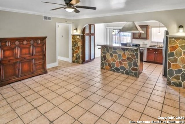 kitchen with ceiling fan, crown molding, light tile patterned floors, and ventilation hood