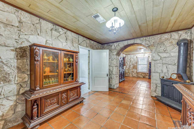 interior space featuring ornamental molding and wood ceiling