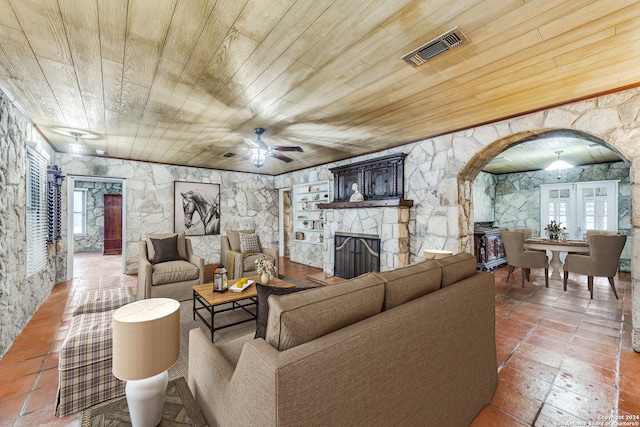 living room with wood ceiling and a wealth of natural light