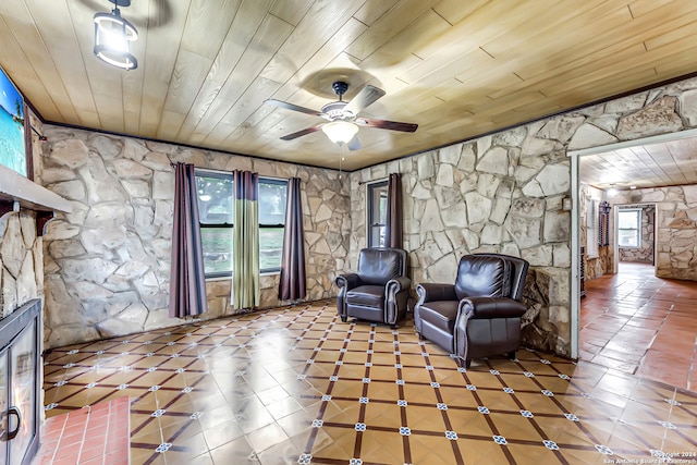 unfurnished room with ceiling fan and wood ceiling