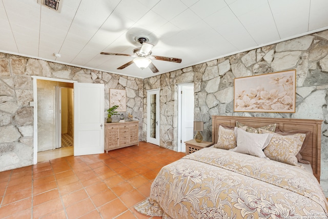 bedroom featuring tile patterned floors and ceiling fan