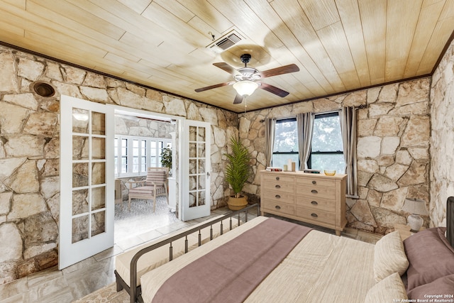 bedroom featuring ceiling fan, french doors, and wooden ceiling