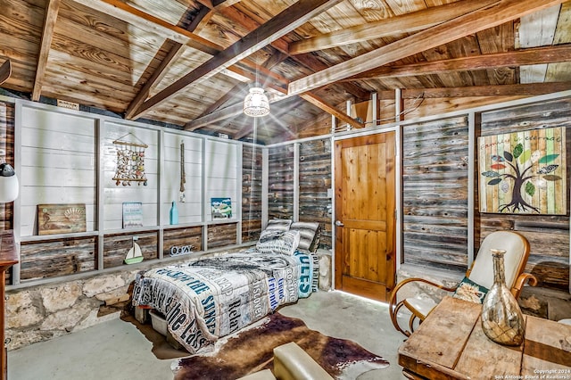 bedroom with vaulted ceiling with beams, wood walls, and wood ceiling