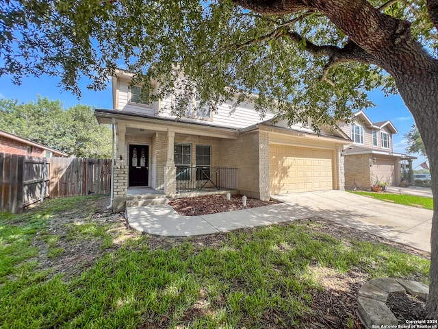 view of front of property featuring a garage and a porch