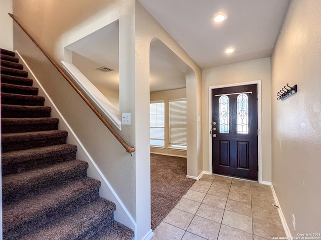 foyer with light tile patterned floors