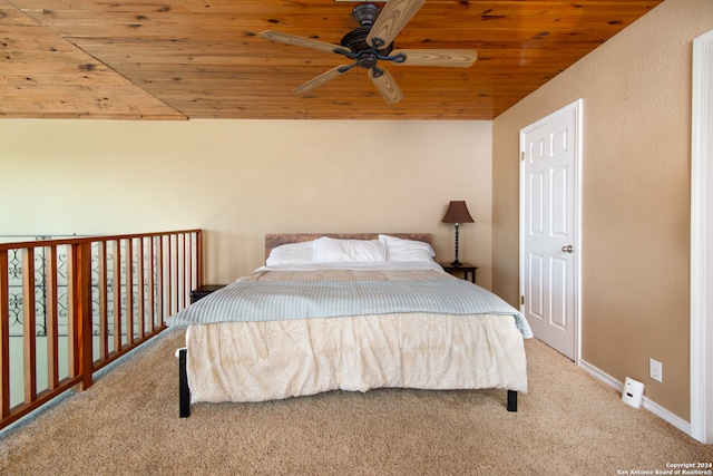 bedroom featuring carpet floors, wood ceiling, and ceiling fan