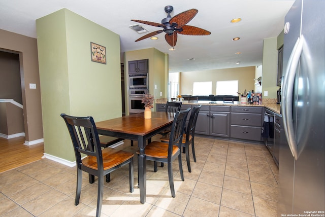 dining room featuring ceiling fan and light tile patterned floors