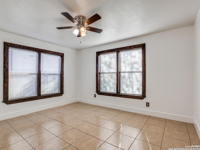 unfurnished room featuring light tile patterned floors and ceiling fan