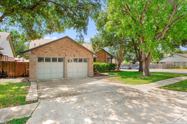 view of front facade with a front lawn and a garage