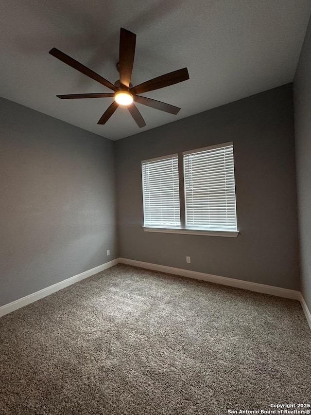 carpeted empty room with ceiling fan