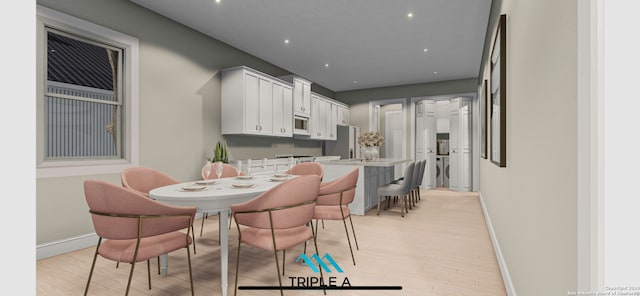 dining room with light hardwood / wood-style flooring