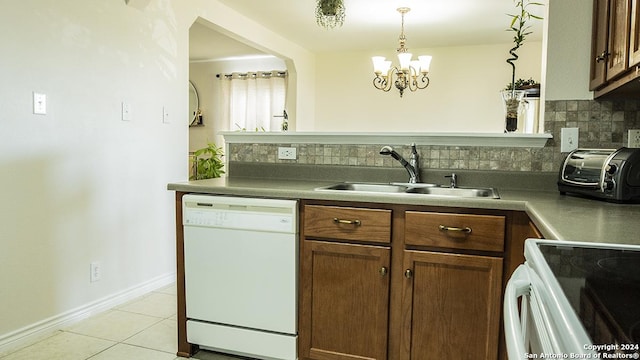 339 Cedron Chase, San Antonio, TX 78253 - kitchen featuring white appliances, decorative backsplash, a sink, light tile patterned flooring, and a chandelier