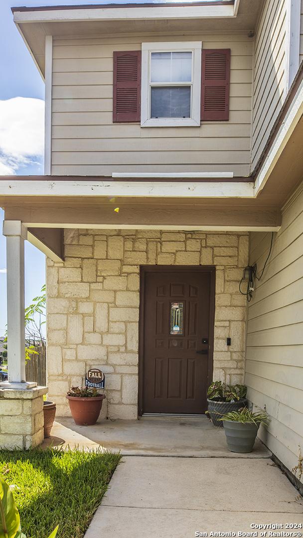 339 Cedron Chase, San Antonio, TX 78253 - view of exterior entry featuring stone siding