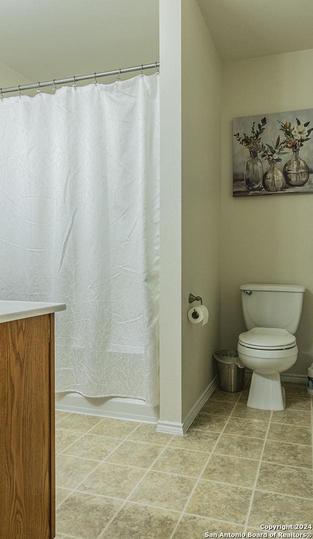 339 Cedron Chase, San Antonio, TX 78253 - full bath with toilet, vanity, baseboards, and a shower with shower curtain