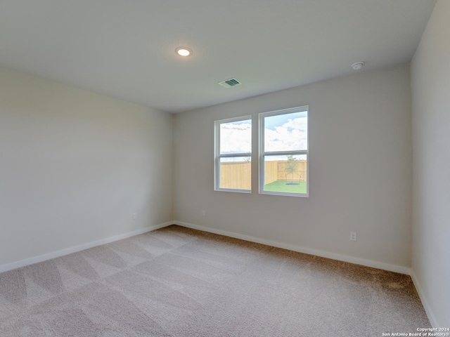 9918 Forestier Grn, San Antonio, TX 78221 - unfurnished room featuring light carpet, baseboards, recessed lighting, and a smoke detector