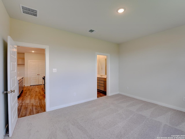 9918 Forestier Grn, San Antonio, TX 78221 - unfurnished bedroom with carpet floors, recessed lighting, baseboards, and ensuite bathroom