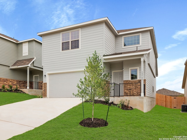 view of front of home featuring a garage and a front lawn