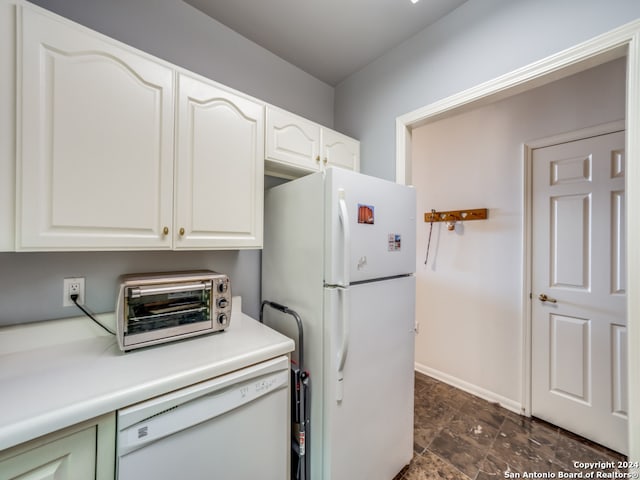 kitchen with white cabinets and white appliances