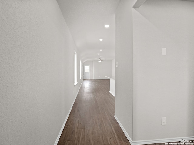 hallway with dark hardwood / wood-style flooring