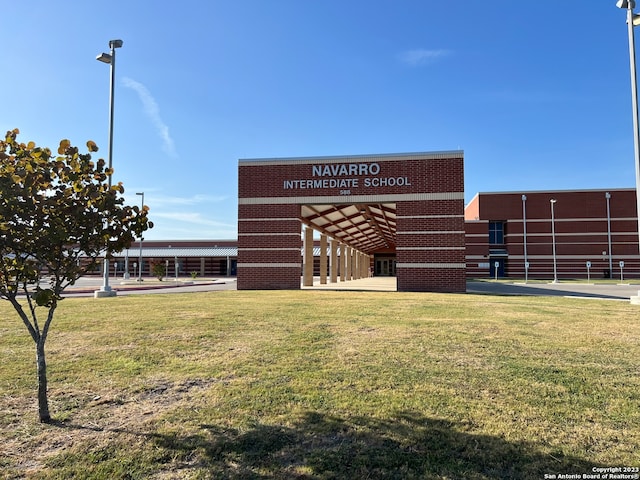 view of outdoor structure with a lawn