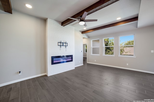 unfurnished living room featuring beam ceiling, ceiling fan, and dark wood-type flooring