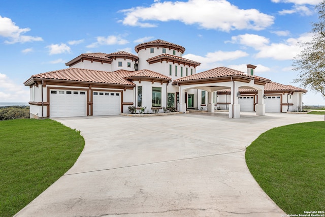 mediterranean / spanish-style house featuring a front lawn