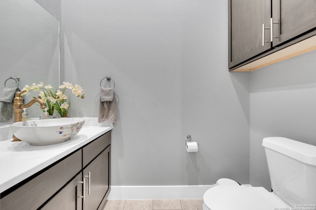 bathroom featuring vanity, toilet, and tile patterned floors