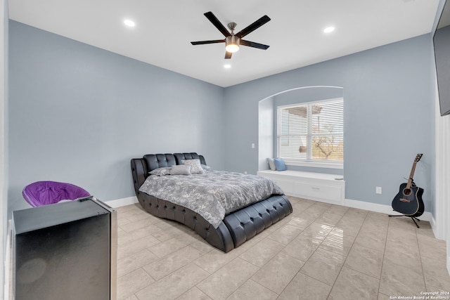 bedroom featuring ceiling fan and light tile patterned floors