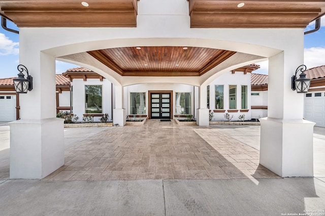 interior space with french doors and a garage