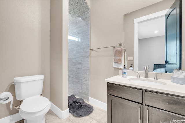 bathroom with vanity, toilet, and tile patterned floors