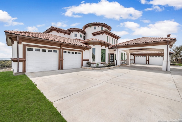 mediterranean / spanish house with a front yard