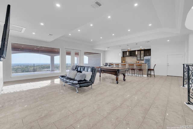 living room with ornamental molding, bar area, and billiards