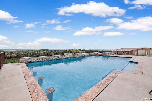 view of swimming pool featuring a patio area