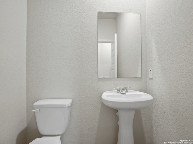 bathroom featuring toilet