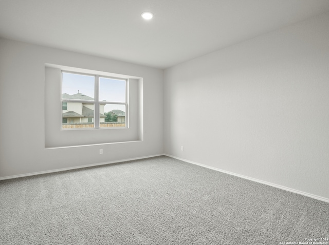 spare room featuring carpet floors