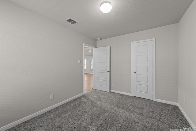 unfurnished bedroom featuring a closet and carpet