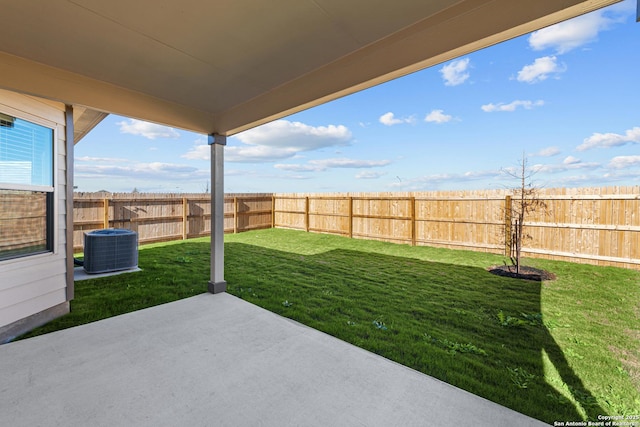 view of yard with a patio and central air condition unit