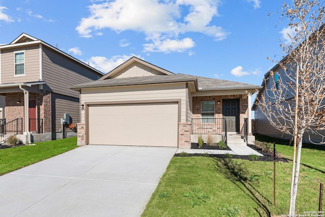 view of front of property with a porch, a garage, and a front lawn