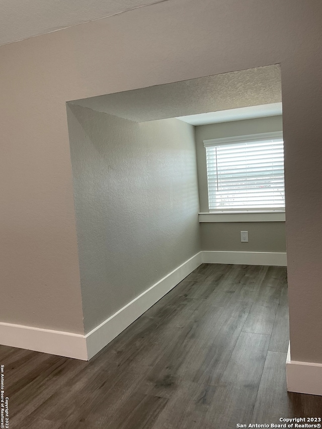 spare room featuring dark hardwood / wood-style flooring