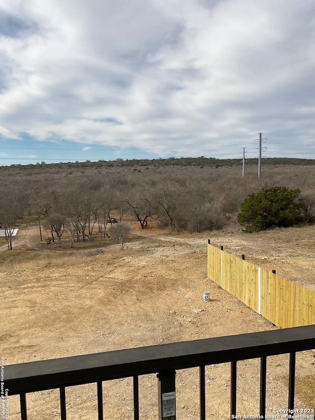 view of yard with a rural view