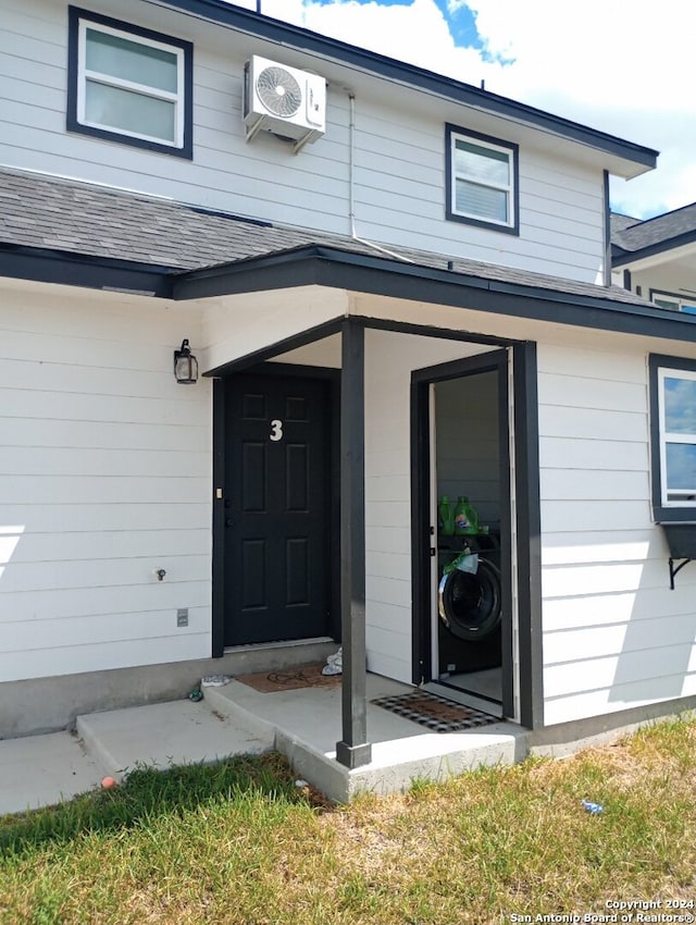 property entrance featuring ac unit