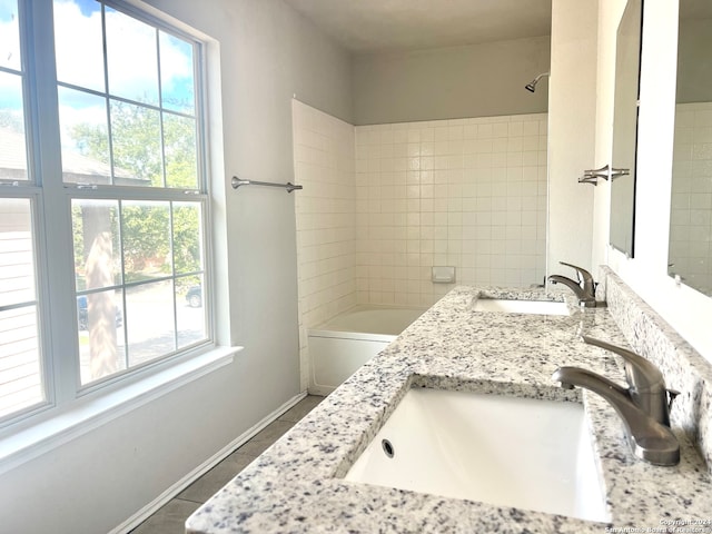 full bathroom with vanity, tiled shower / bath combo, toilet, and tile patterned floors